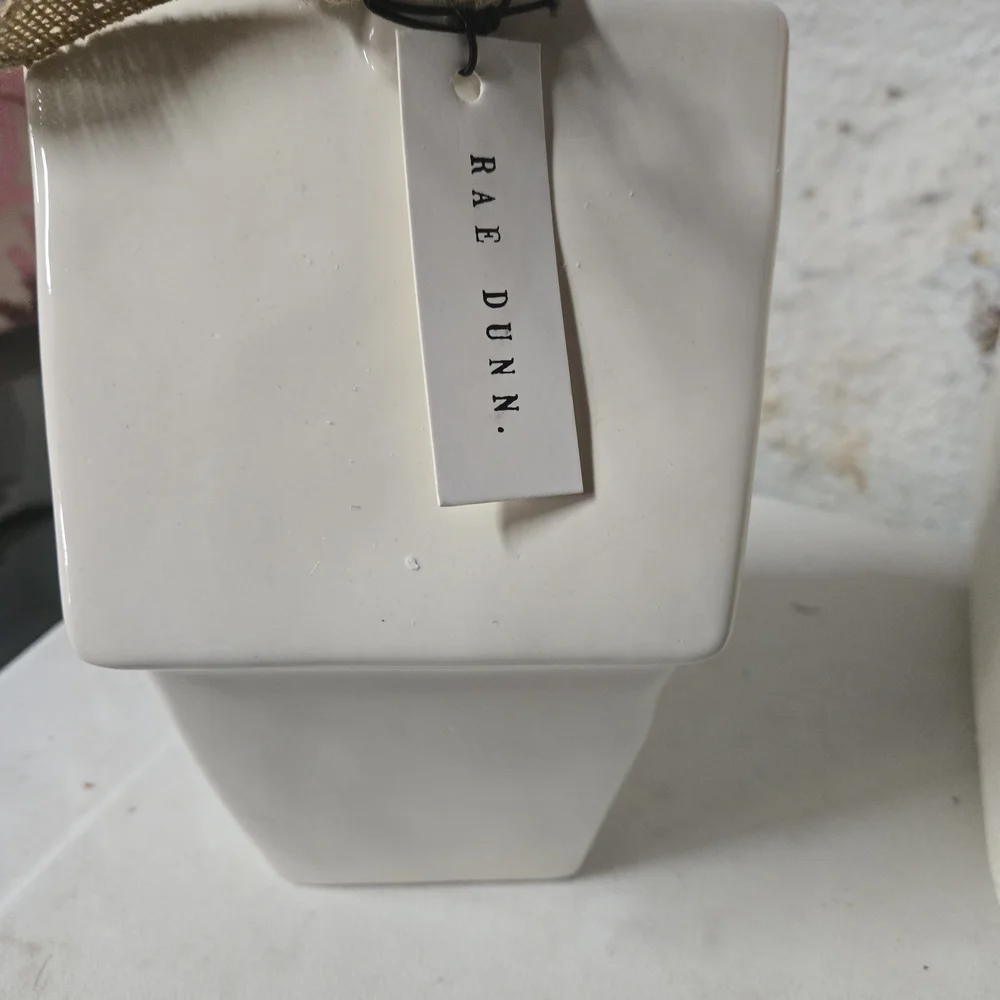 White Ceramic Birdhouse with 'Rest' Inscription